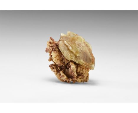 A group of double-terminated, yellow-brown baryte crystals in parallel growth on a crystalline dolomite matrix from Frizzingt