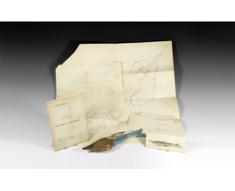 Circa 1930.   A plaster model Pteraspis fossil fish with painted surface in brown and blue; with monochrome photograph of the