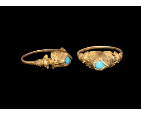 Later 16th-early 17th century AD.   A narrow gold D-section hoop with balustered shoulders and lateral wings, rectangular-sec