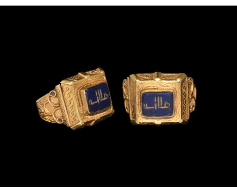 15th-19th century AD.   A lapis lazuli intaglio calligraphic text Allah, set into a later flat-section gold hoop with scroll 