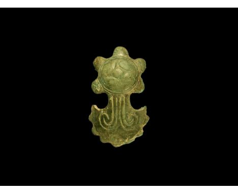 1st century BC-1st century AD.A bronze mount comprising a low dome with D-shaped radiating lobes, pelta-shaped body with inci