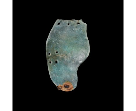 4th-1st century BC.A cheek guard from a Montefortino type helmet with three attachment holes to the top, four to the side and
