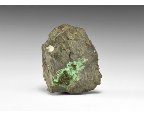 A matrix specimen of green cupro-adamite crystals within a vug of another copper mineral, from Tsumeb, Namibia; in white card