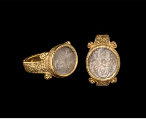 16th century AD.   A substantial rectangular-section gold hoop with recesses to the edges, scale pattern panels to the should