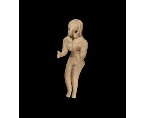 4th-3rd millennium BC.A seated ceramic figure of a female, possibly a goddess, with applied bands to the top of the head for 