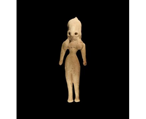 4th-3rd millennium BC.A ceramic figure of a female with dome-shaped head, traces of headdress to the top, applied hair fallin