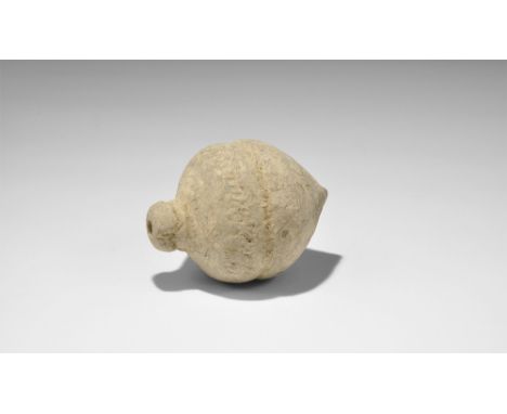 9th-11th century AD.   A hollow ceramic vessel with domed top and conical base intended to be filled with explosive liquid an