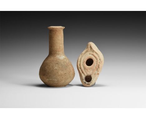 3rd-4th century AD.A mixed ceramic group comprising: a plain bulbous bottle with thick neck, flared rim; a leaf-shaped lamp w