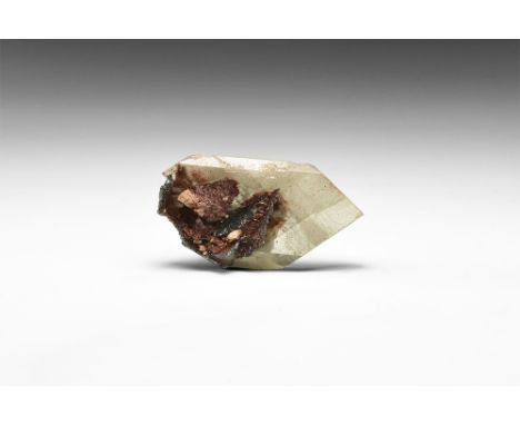 A well-terminated crystal of yellow baryte with accessory haematite from the classic Cumbrian locality; in white card tray wi