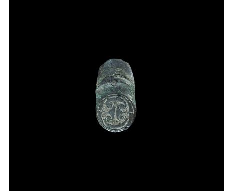 2nd century BC-1st century AD.A convex enamelled bronze finial, possibly from a bracelet, with raised flange to the upper fac