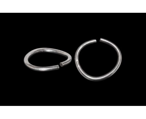 7th-1st century BC.A silver round section open-ended torc bracelet formed from a single rod. 60 grams, 65mm (2 1/2"). Very fi