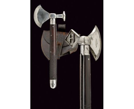 A combination axe with saw blade knife dating: circa 1900 provenance: London Iron head with round axe and squared handle feat