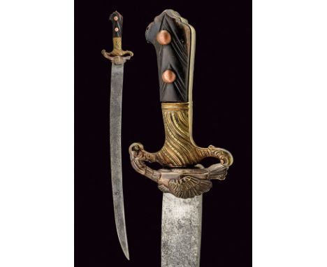 A hunting hunger dating: circa 1800 provenance: Eastern Europe Heavy, curved, single-edged blade; brass hilt with remains of 