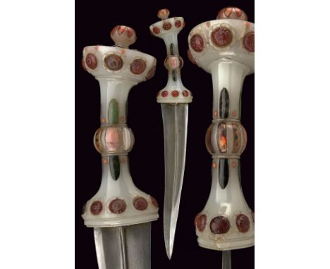 A beautiful dagger with Mutton Fat Jade hilt dating: early 18th Century provenance: India Moghul Slightly curved, double-edge