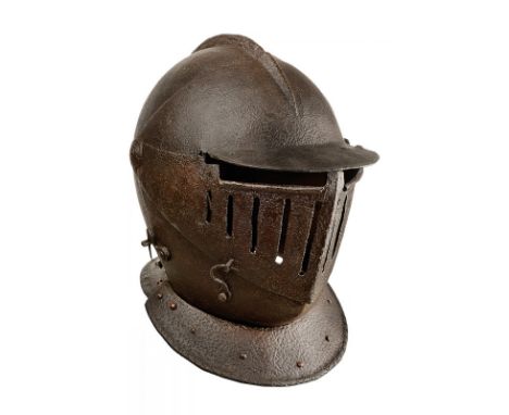 A Savoyard helmet dating: 17th Century provenance: Northern Italy Iron skull, worked in two pieces joint to the central comb.