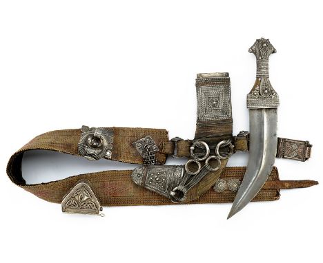 A luxury silver mounted jambiya (dagger) dating: 19th Century provenance: Oman Curved, double-edged blade with raiser at the 