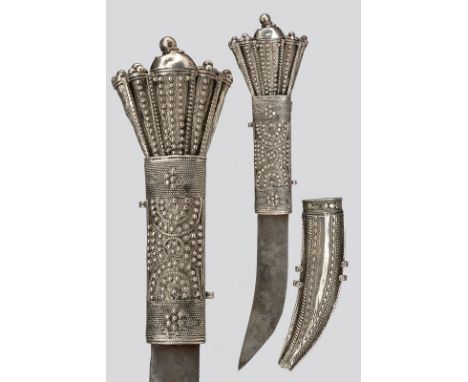 A Shafra (knife) dating: circa 1900 provenance: Arabia Simple, curved, , slightly engraved, single-edged blade; silver-inlaid