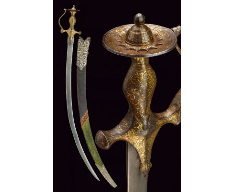 A gilded tulwar dating: 19th Century provenance: India Thin, curved, single-edged blade of triangular section, with slightly-