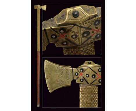A miners parade axe dating: 19th Century provenance: Eastern Europe Brass head, finely engraved and decorated with red and bl