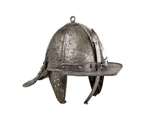 A lobster tail helmet dating: 17th Century provenance: Northern Germany Skull in two pieces, decorated with six raisers, smal