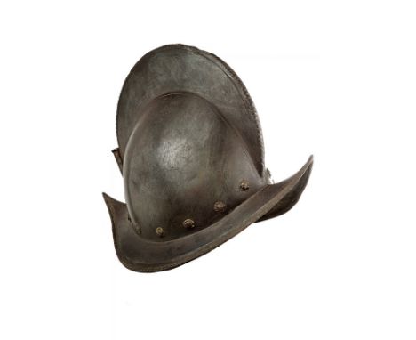 A morion dating: 16th Century provenance: Europe Iron skull in one piece, surmounted by a relieved crest with twisted border.