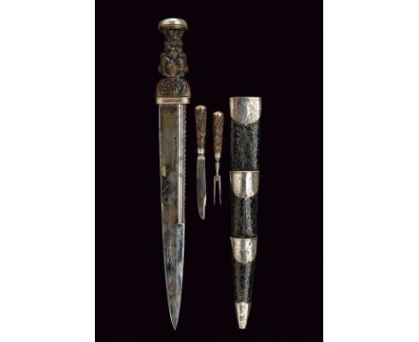 A dirk dating: 19th Century provenance: Scotland Straight, single-end false-edged blade, carved with waves and grooves at the