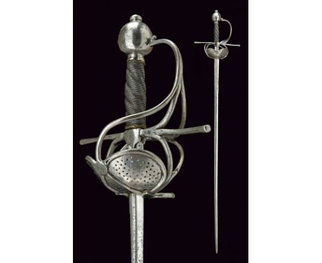 A rare left hand rapier dating: circa 1600 provenance: France Straight, double-edged blade of hexagonal section, grooved at t