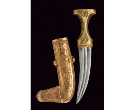 A jambiya dating: 20th Century provenance: Arabian Peninsula Curved, double-edged blade with raiser at the center. Gilt, silv