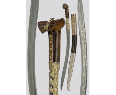 An Ephesus yatagan dating: early 19th Century provenance: Anatolia Interesting, curved, damask, single-edged blade, richly de