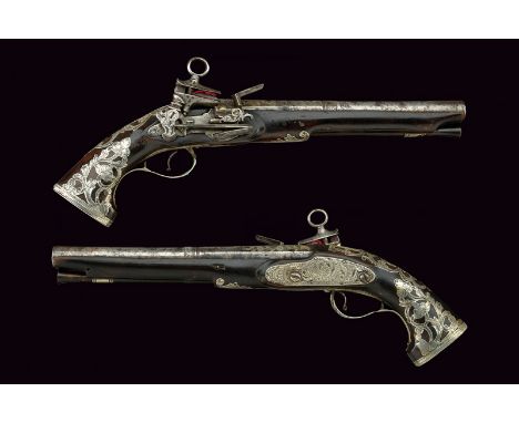 A pair of flintlock pistols dating: circa 1700 provenance: Spain Smooth, two-stage, 17 mm cal. barrels, octagonal at the firs