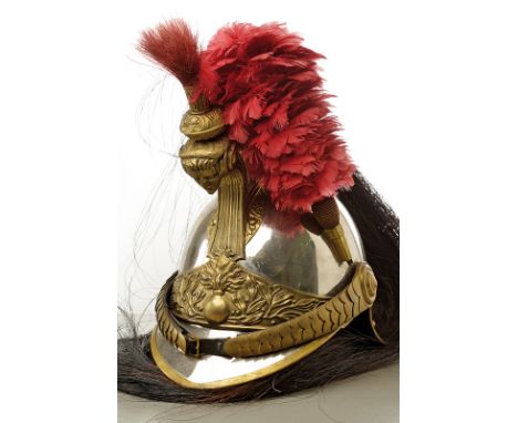 A cuirassier trooper's helmet dating: 19th Century provenance: France Iron skull, decorated with a flaming grenade at the fro