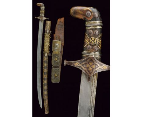 A sabre with belt dating: late 19th Century provenance: Georgia Slightly-curved, single-and false-edged blade, featuring a tr