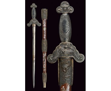 A sword dating: 19th Century provenance: Vietnam Simple, double-edged blade; silver hilt, embossed with dragon and floral mot