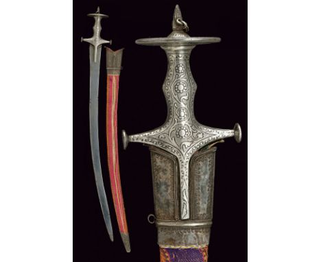 A tulwar dating: early 19th Century provenance: India Curved, single-and false-edged blade, made of damask. Hilt and grip in 