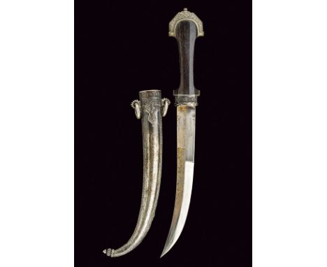 A silver mounted koummiya dating: early 20th Century provenance: Morocco Curved, single-and half-edged blade, engraved with f