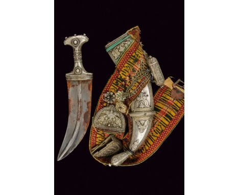 A silver mounted jambyia with belt dating: late 19th Century provenance: Yemen Wide, curved, double-edged blade with raisers 