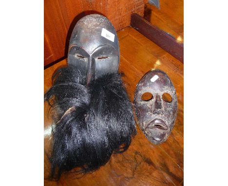 Tribal Art - Ivory Coast Dan mask with beard and another Dan mask
