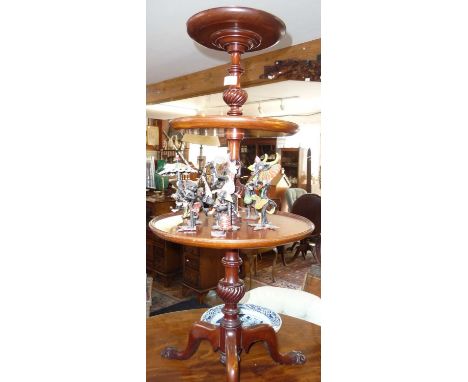Victorian mahogany 3 tier circular buffet with revolving graduated shelves on turned column, above tripod base with carved ba