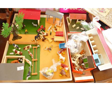 Wooden toy farmyard with many Britains plastic animals and figure, etc including Corgi horsebox