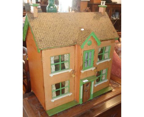 1930's dolls house with doors opening onto linoleum and lace curtains