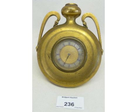 Unusual desk clock in brass, shaped like a bottle, inscribed verso " Ye Pylgrynas Bottel", maker Howell, James &amp;Co, 5" x 