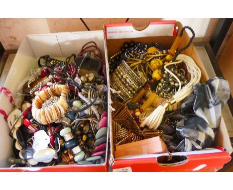 Two shoe boxes of costume jewellery 