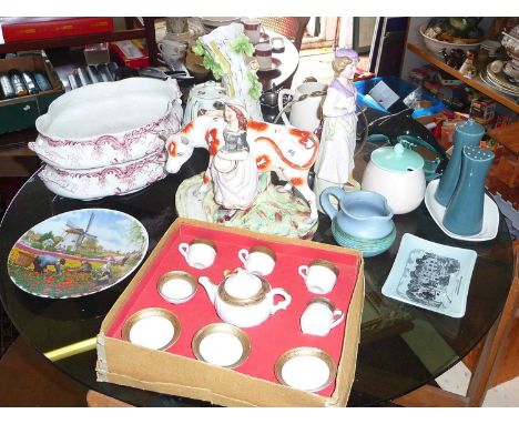 Assorted pottery including Poole Pottery cruet, dolls china tea set, Staffordshire cow with milkmaid, etc