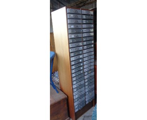 Tall cabinet of 50 metal drawers 