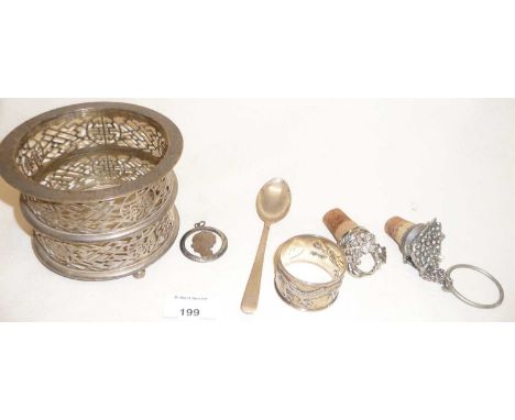 Chinese export silver napkin ring decorated with a dragon and marked as from WING ON, a sterling spoon from Hong Kong,a pierc