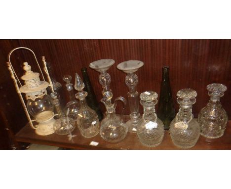 Seven old glass decanters, pair of glass candlestands, a candleholder in the form of a hanging lantern etc