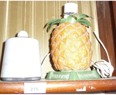 A 1950's Bakelite Bridport Industries table lighter and a Britvic pineapple table lamp