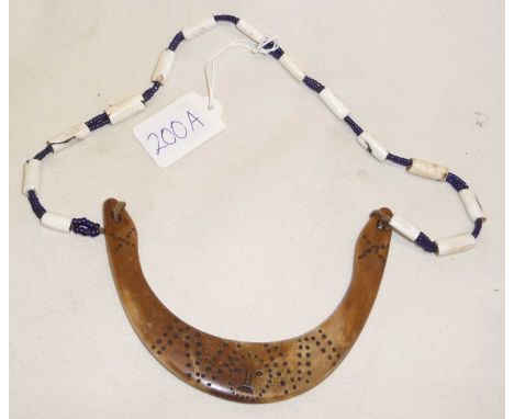 Tribal Art - a Naga necklace with incised bone pendant , Indian