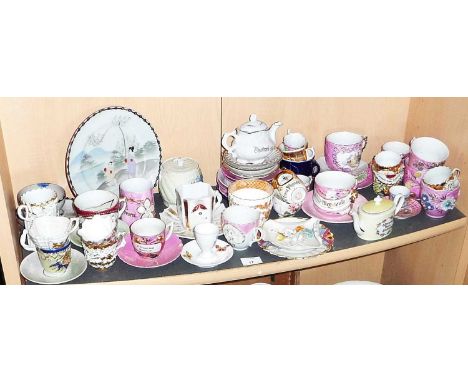 Large collection of Victorian seaside souvenir and pink lustre cups and saucers including moustache cups