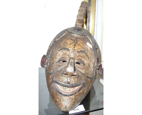 Tribal Art - African Ibo Nigerian boys carved and painted wood initiation mask.